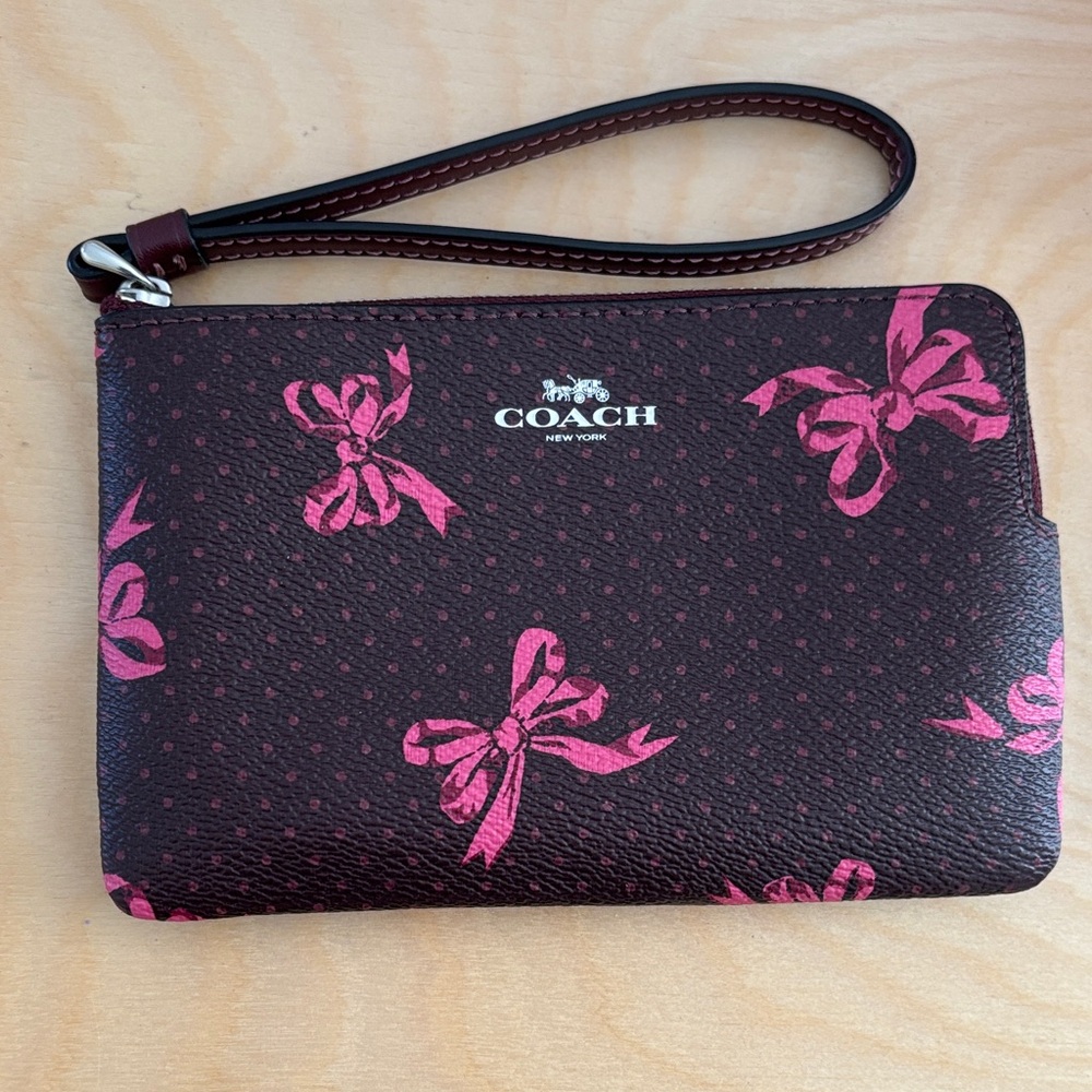 Coach Dark Brown Wristlet with Pink Bow Accents